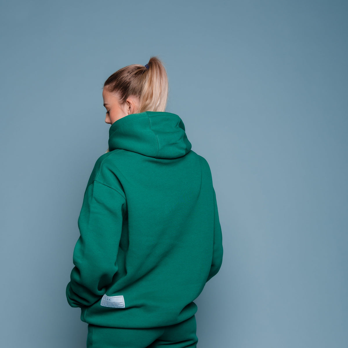 Kapuzenpullover in der farbe Forest green